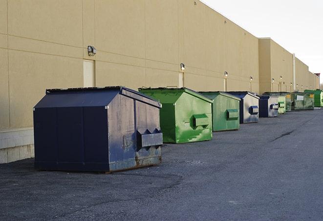 a stack of yellow construction dumpsters on a job site in Covina